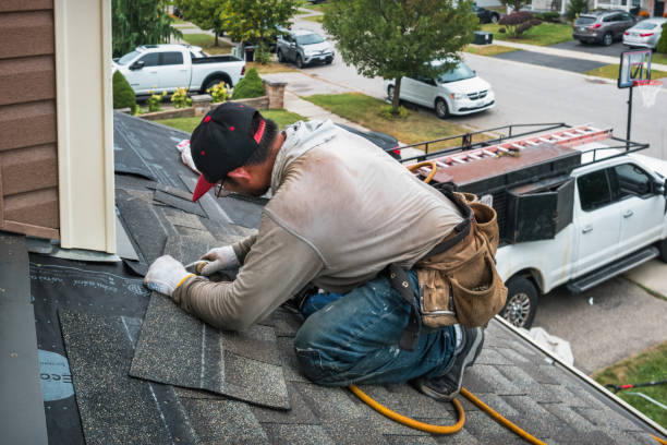 Professional Roofing technician working in Readville, MA